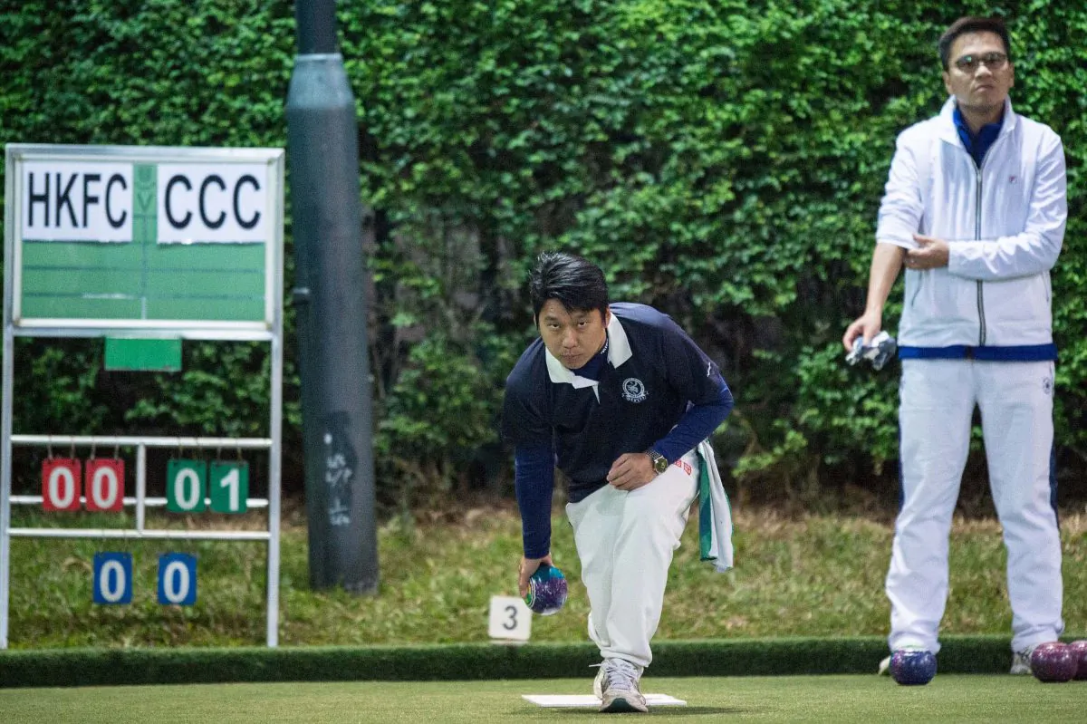 Lui Chin Hong (delivering) of Craigengower Cricket Club on his way to defeating Tony Cheung from the Hong Kong Football Club to lift the Men’s Knockout Singles trophy on Sunday night (Dec 17). (Panda Man/ Takumi Photography)
