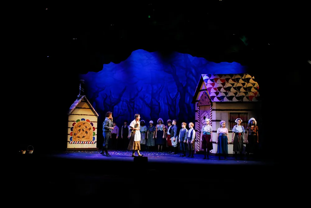 Hansel (Sarah Klopfenstein) and Gretel (Samantha Jeffreys) discover with surprise that children have been released from their gingerbread state, in a Nashville Opera production of “Hansel and Gretel” directed by Stuart Holt. (Reed Hummell/Nashville Opera)