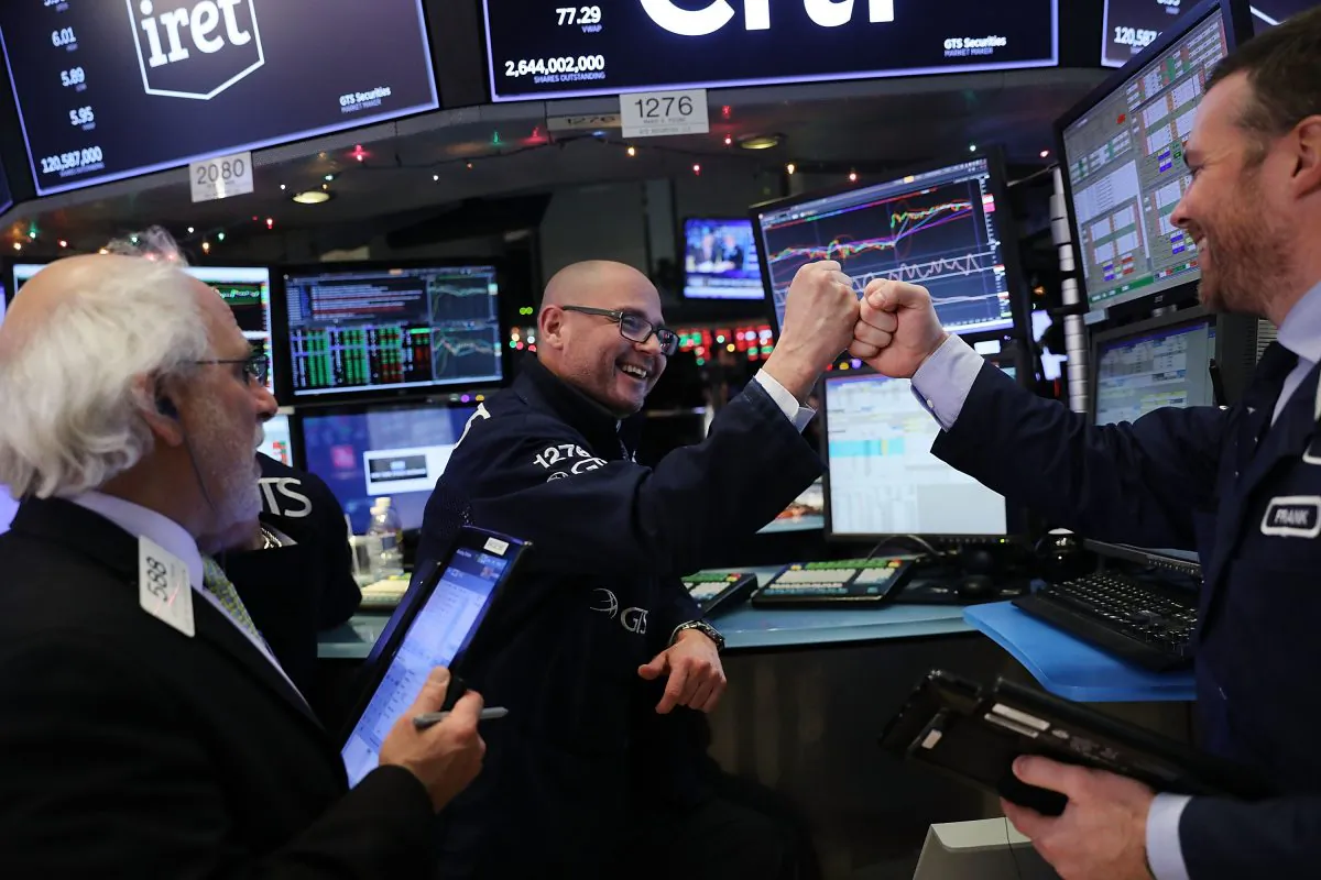 Traders work on the floor of the New York Stock Exchange at the end of the trading day on Dec. 4. 2017 has seen 70 new record highs in the stock market, the most ever. (Spencer Platt/Getty Images)