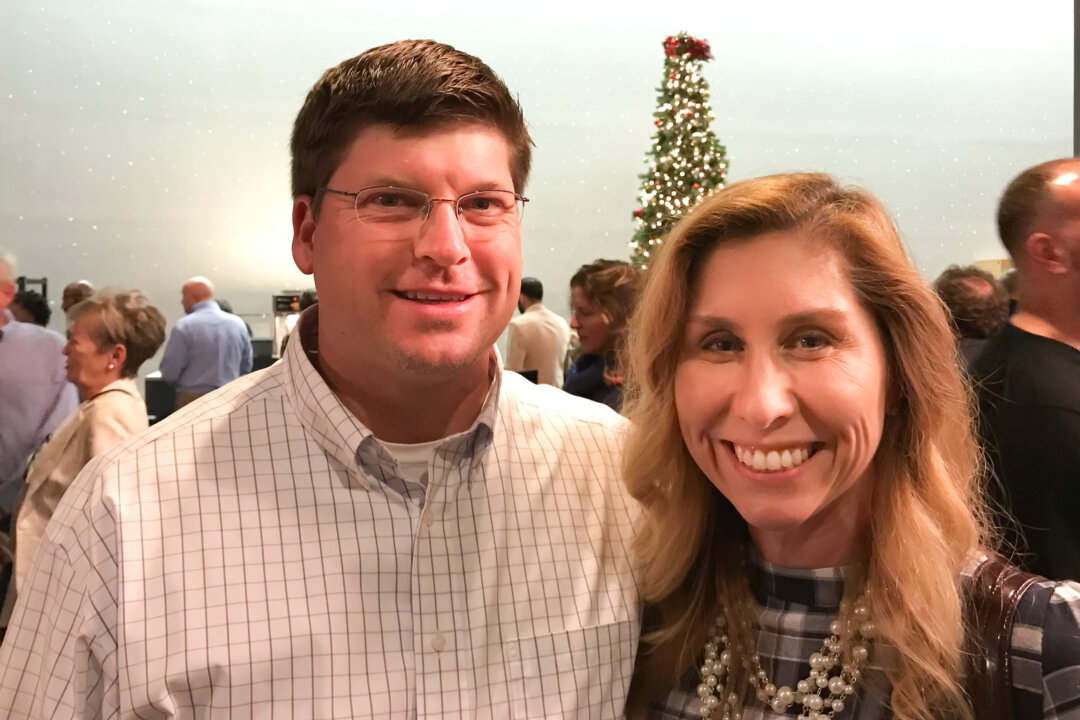Stephen Dees and his friend enjoyed watching Shen Yun at Johnny Mercer Theatre in Savannah, Georgia, on Dec. 23, 2017. (Roland Ree/The Epoch Times) 