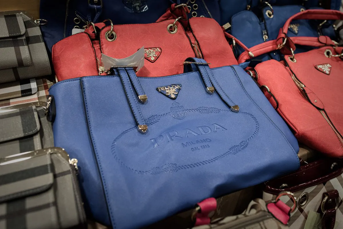 Counterfeit Prada handbags are displayed at a press conference following a record seizure at the customs headquarters in Hong Kong on August 6, 2015. (Philippe Lopez/AFP/Getty Images)