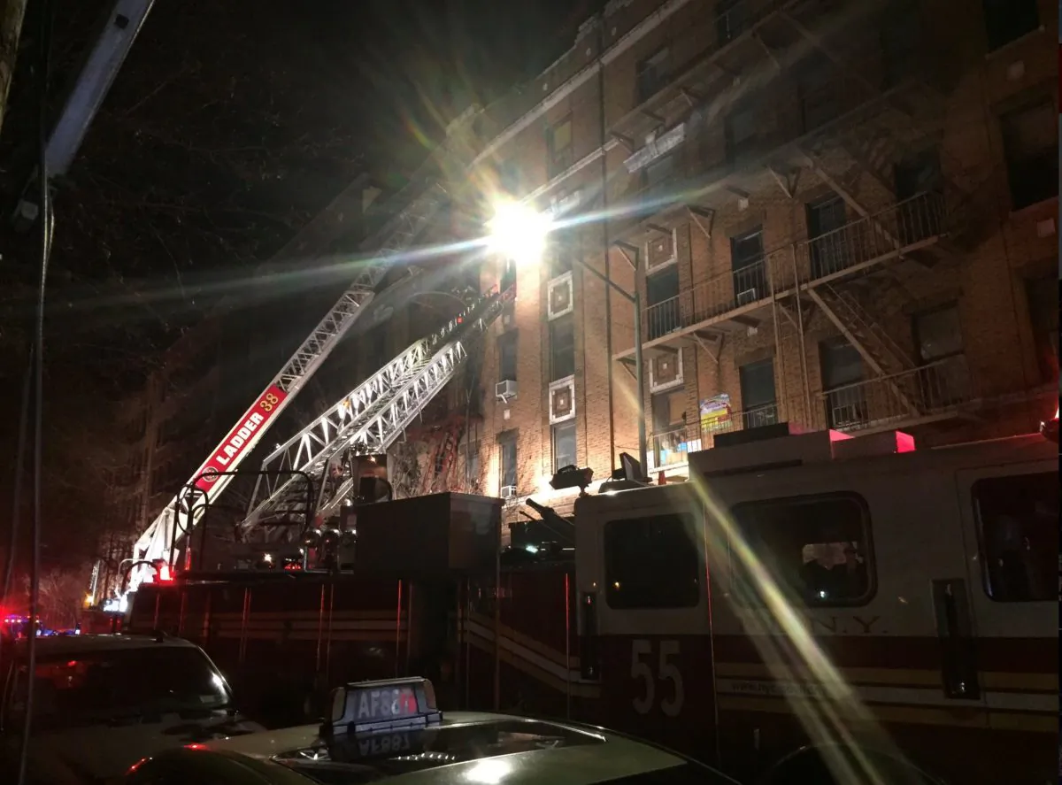 New York Fire Department ladder trucks deploy at a building fire in the Bronx borough of New York City, New York, U.S. December 28, 2017.  (NYFD/Handout via REUTERS)