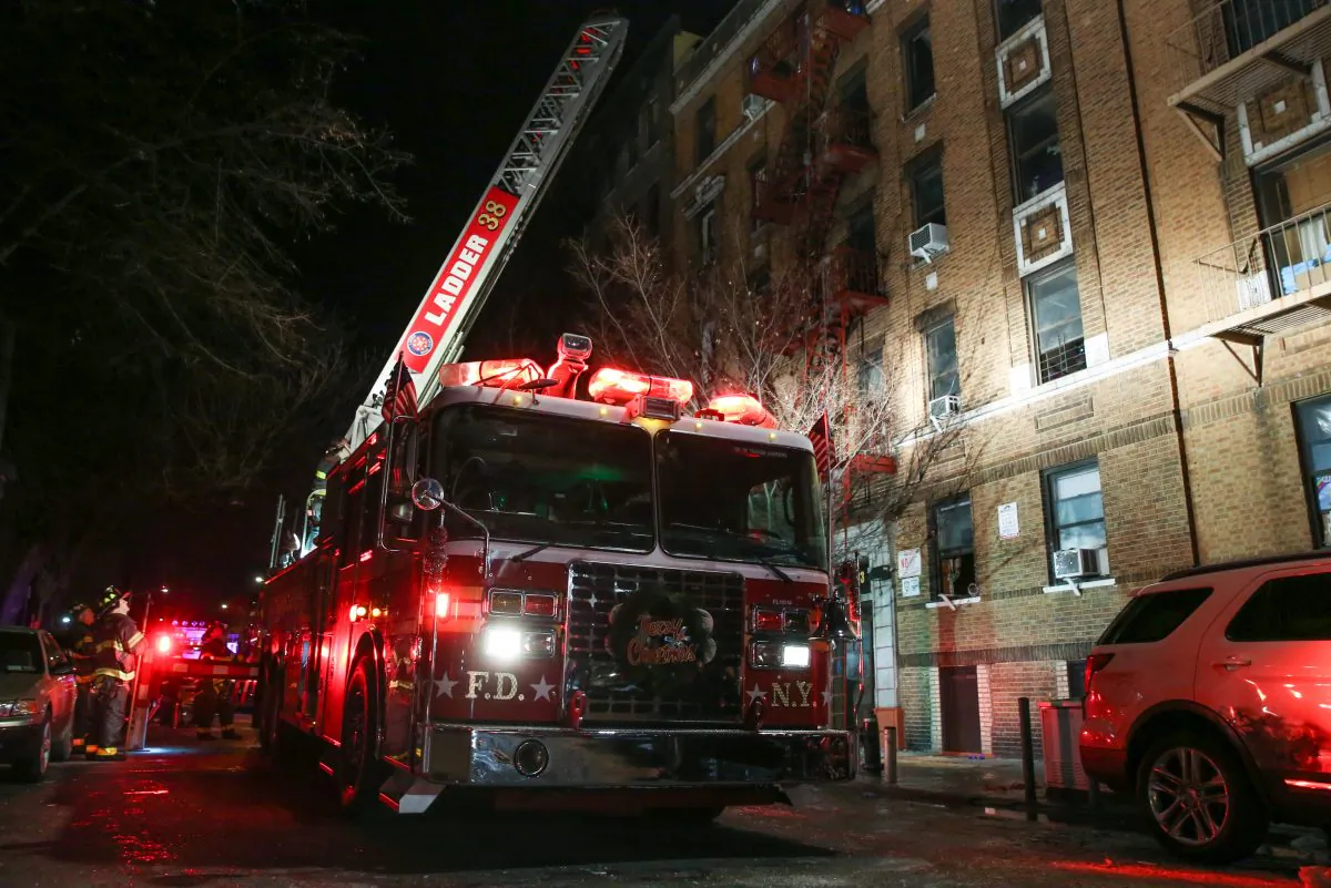 Fire Department of New York (FDNY) personnel work on the scene of an apartment fire in Bronx, N.Y., on Dec. 28, 2017. (Reuters/Amr Alfiky)
