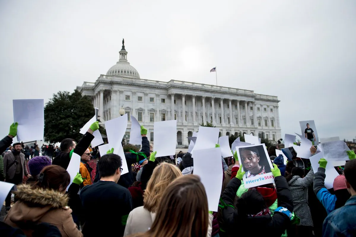 People protest the termination of the Deferred Action for Childhood Arrivals (DACA) outside the Capitol Building on Capitol Hill, Washington, on Dec. 6, 2017. (BRENDAN SMIALOWSKI/AFP/Getty Images)