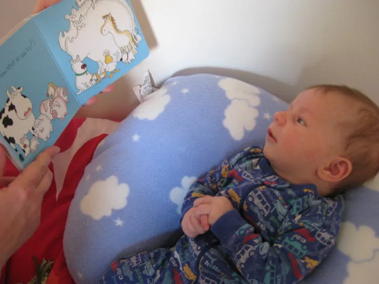 Even the littlest listeners can enjoy having a book read to them. Maggie Villiger, CC BY-ND