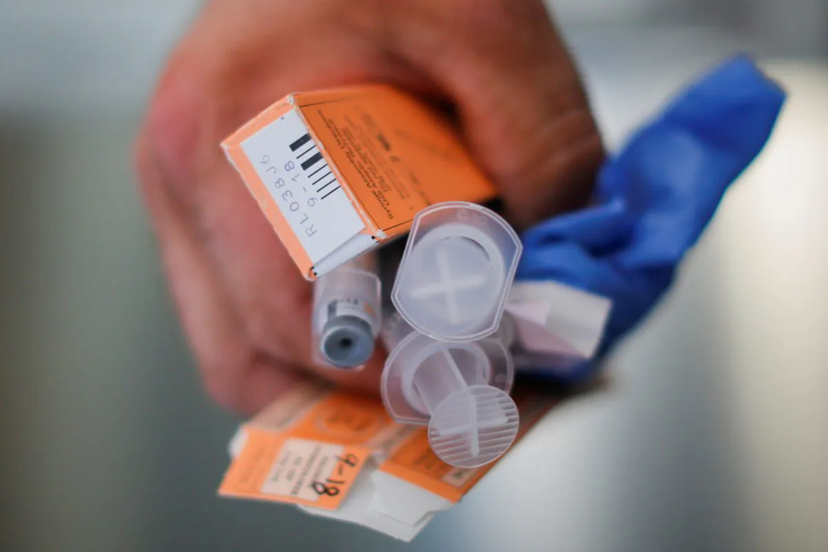 In this photo (not directly related to the story) a medic holds used doses of a dangerous drug after medics revived a man who had overdosed. (Reuters/Brian Snyder)