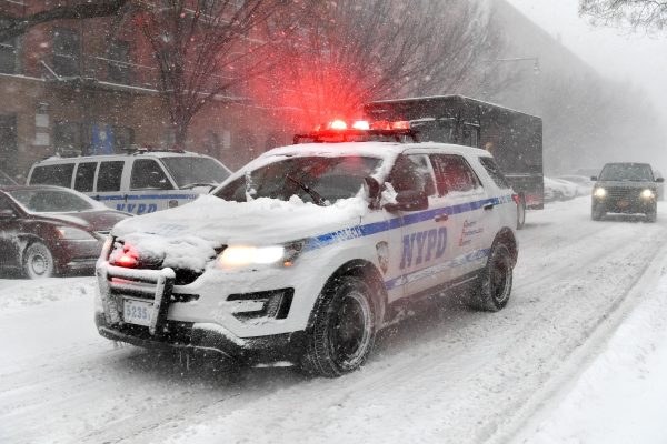 NEW YORK, NY - JANUARY 04: A NYPD vehicle drives through Harlem during a snowstorm on January 4, 2018 in New York City. As a major winter storm moves up the Northeast corridor, New York City is under a winter storm warning and forecasts are calling for six to eight inches of snow. (Photo by Dia Dipasupil/Getty Images)