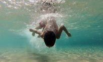 Drone Operator Screams at Swimming Boy Unaware of Mortal Danger