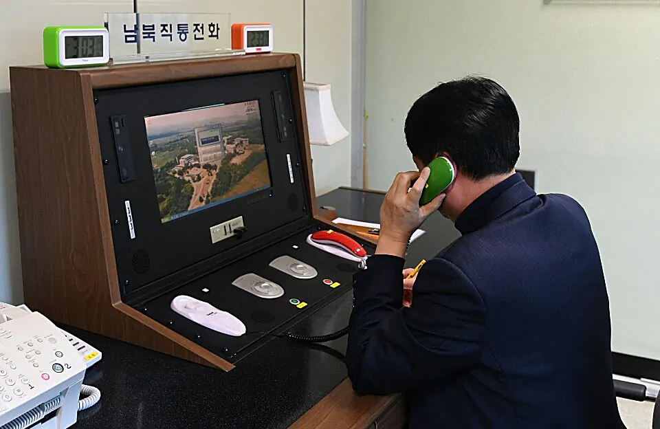 A South Korean government official checks the direct communications hotline to talk with the North Korean side at the border village of Panmunjom in Panmunjom, South Korea on Jan. 3, 2018. (South Korean Unification Ministry via Getty Images)