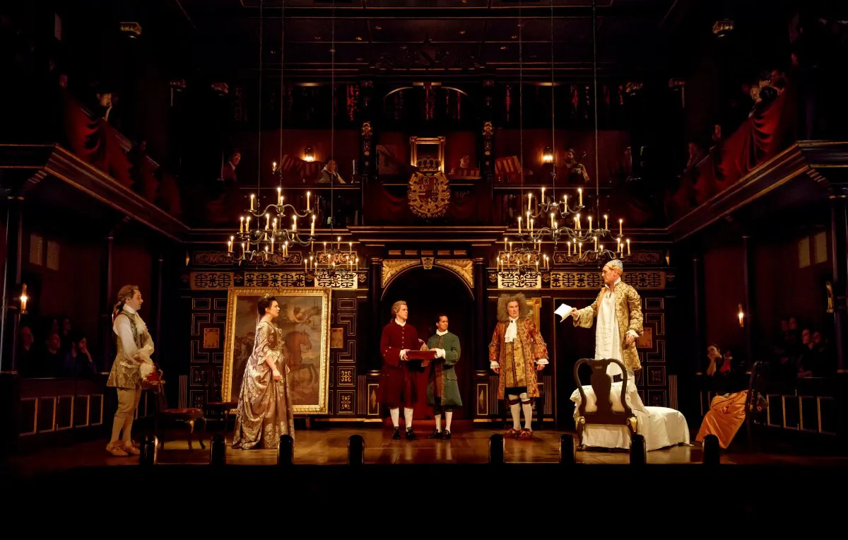 The cast of "Farinelli and the King": (L–R) Sam Crane, Melody Grove, Lucas Hall, Huss Garbiya, Edward Peel, and Mark Rylance. The evocative set is by Jonathan Fensom. (Joan Marcus)