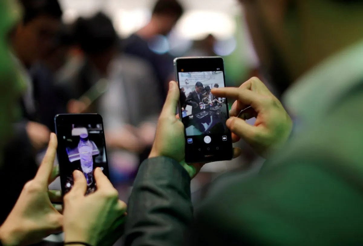 Visitors try Huawei's devices during Mobile World Congress in Barcelona, Spain, Feb. 27, 2017. (Reuters/Eric Gaillard/File Photo