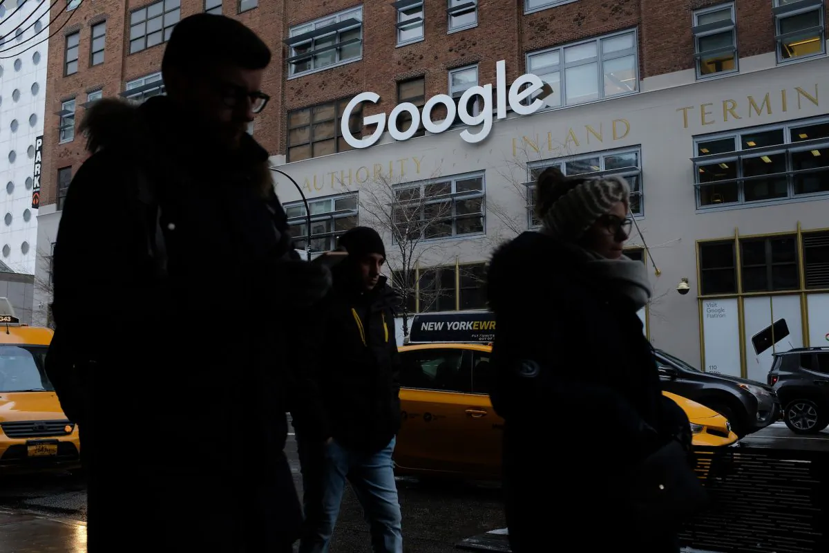 NEW YORK, NY - DECEMBER 30:  People walk past a Google office building on 9th Avenue in Chelsea district on December 30, 2017 in New York City. The building, known officially by its address of 111 8th Avenue, is among the city's biggest office buildings and is wholly owned by Google.  (Sean Gallup/Getty Images)