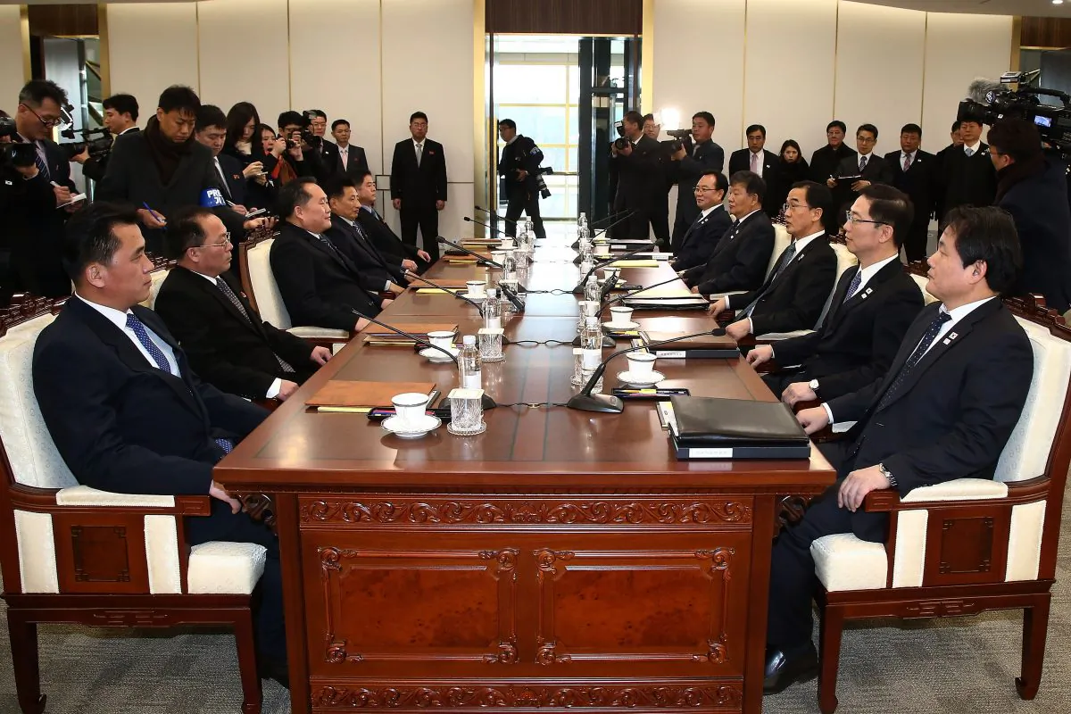 South Korean Unification Minister Cho Myoung-gyon (R) talks with the head of North Korean delegation Ri Son-Gwon (L) before their meeting at the Panmunjom in the Demilitarized Zone on Jan. 9, 2018 in Panmunjom, South Korea. (Korea Pool/Getty Images)