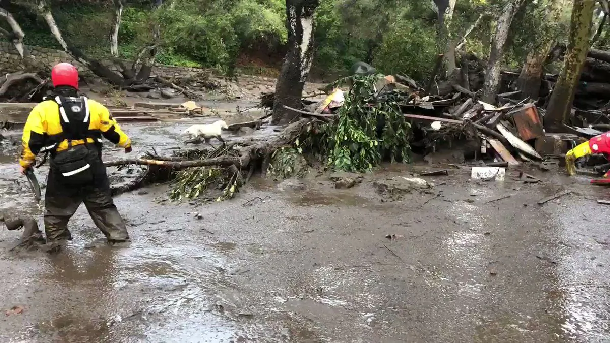 Emergency personnel search through debris and mudflow in this still photo taken from video provided by the Santa Barbara County Fire Department after a mudslide in Montecito, Calif., on Jan. 9, 2018. (Courtesy of the Santa Barbara County Fire Department)
