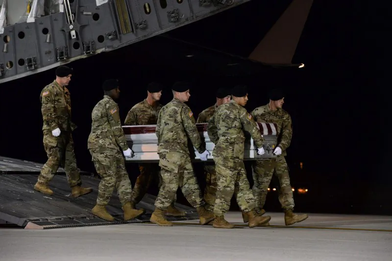 A U.S. Army carry team transfers the remains of Army Staff Sgt. Dustin Wright of Lyons, Georgia, at Dover Air Force Base in Delaware, U.S. on Oct. 5, 2017. (Aaron J. Jenne/U.S. Air Force/Handout via Reuters)
