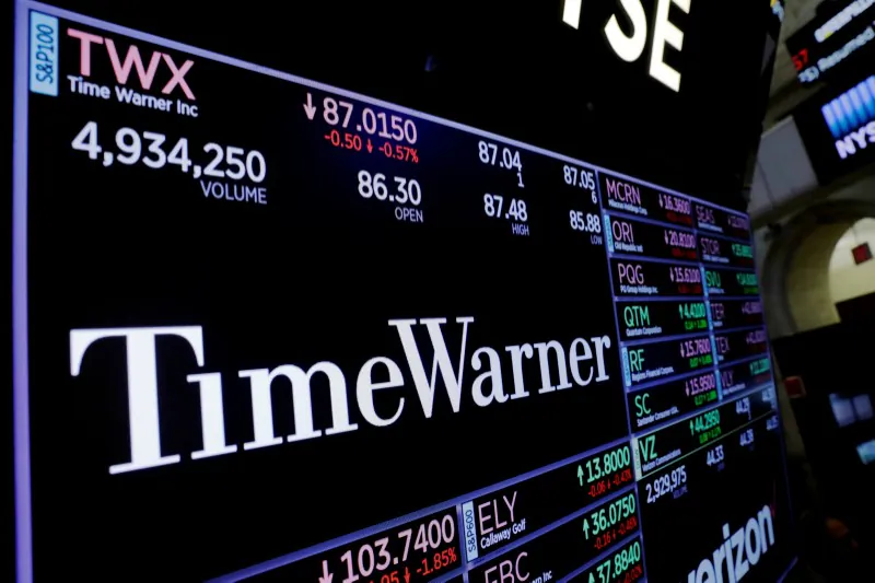 A screen shows the current price of Time Warner shares, above the floor of the New York Stock Exchange, shortly after the opening bell in New York, U.S. on Nov. 15, 2017. (Reuters/Lucas Jackson/File Photo)