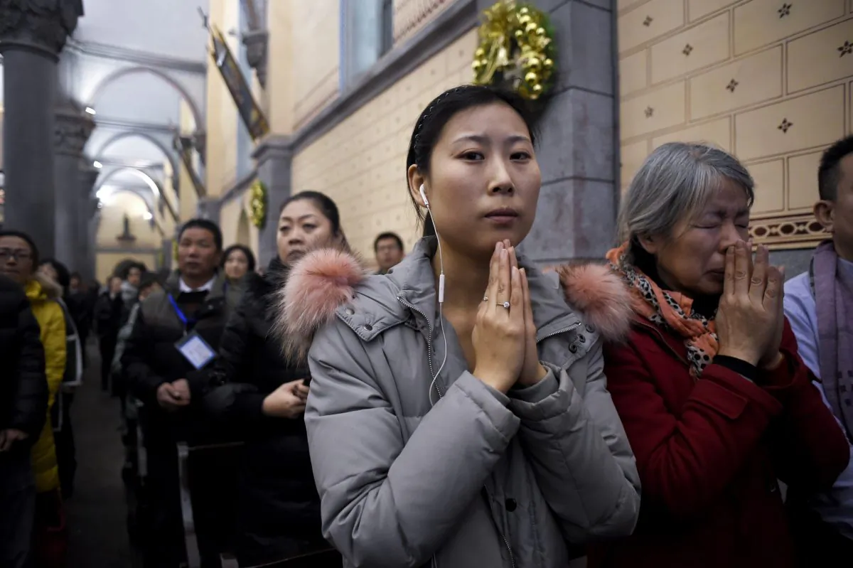 Chinese Christians attend Christmas Eve mass at a Catholic church in Beijing, on Dec. 24, 2016. (Wang Zhao/AFP/Getty Images)