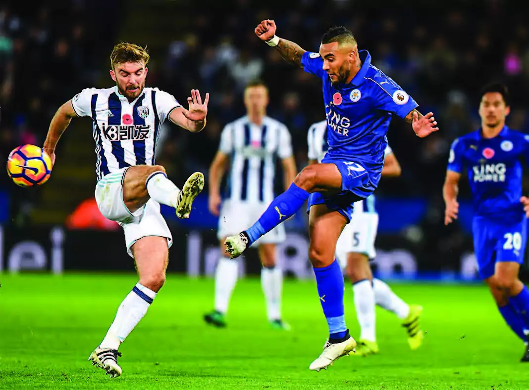 The team West Bromwich Albion (L), which is being sponsored by K8.com, an online casino company, plays against Leicester City during a Premier League match in Leicester, England, on Nov. 6, 2016. (MICHAEL REGAN/GETTY IMAGES) 