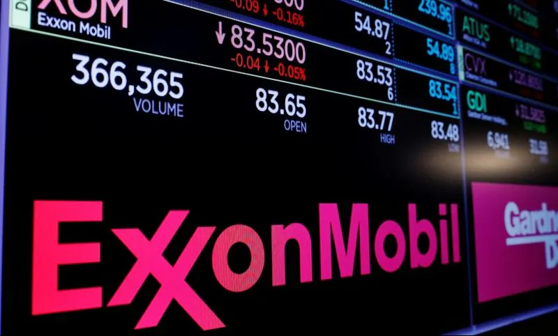 A logo of Exxon Mobil is displayed on a monitor above the floor of the New York Stock Exchange shortly after the opening bell in New York, U.S., December 5, 2017.  REUTERS/Lucas Jackson - RC17B6EE3C30