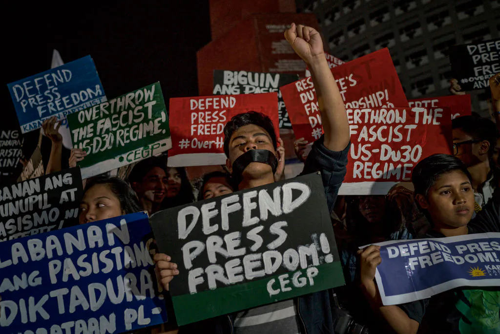 Journalists and activists stage a protest calling to defend press freedom in suburban Quezon City in Metro Manila, Philippines, on Jan. 19, 2018. (Jes Aznar/Getty Images)