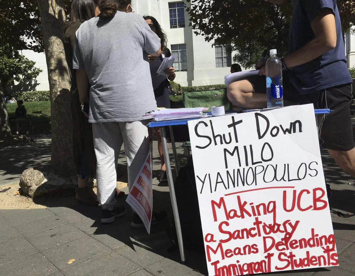 A booth calls for protesters to “shut down” controversial right-wing commentator Milo Yiannopoulos, on Sproul Plaza at the University of California, Berkeley on Sept. 21, 2017. (Jocelyn Gecker/AP Photo)