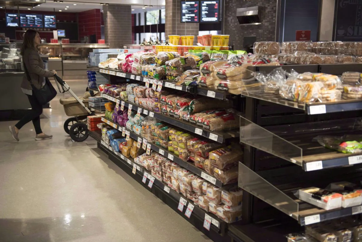Various brands of bread sit on shelves in a grocery store in Toronto. (The Canadian Press/Doug Ives)