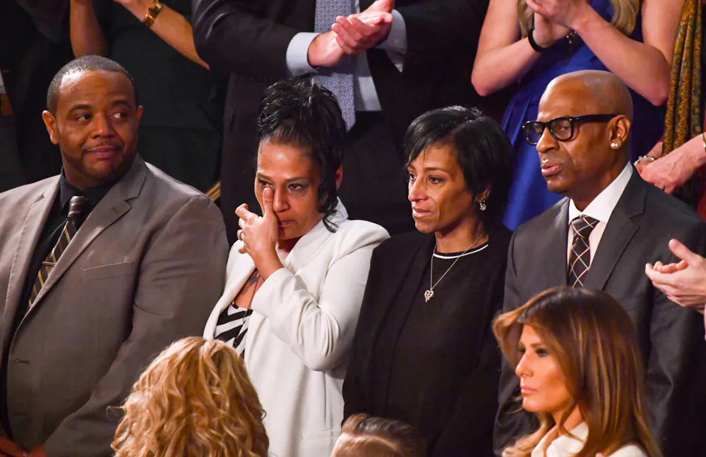 (L–R) Robert Mickens, Elizabeth Alvarado, Evelyn Rodriguez, and Freddy Cuevas—parents of slain teenage girls—are recognized during the State of the Union address at the U.S. Capitol on Jan. 30, 2018. (NICHOLAS KAMM/AFP/Getty Images)