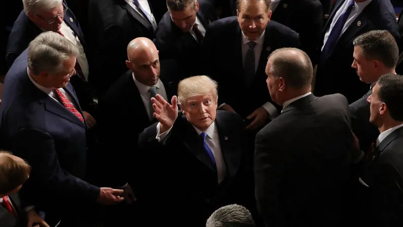President Donald J. Trump waves to guests calling his name from the galleries following the State of the Union address in the chamber of the U.S. House of Representatives in Washington, DC, Jan. 30, 2018. This is the first State of the Union address given by President Trump and his second address to a joint meeting of Congress. (Chip Somodevilla/Getty Images)