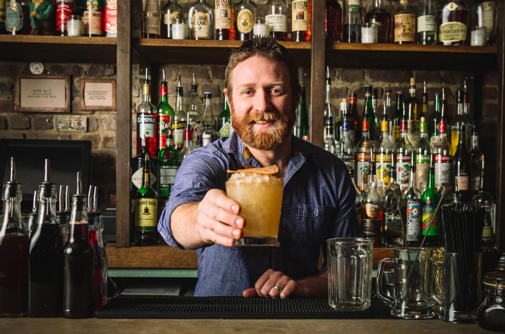 Is mixologist Mike Di Tota holding a cocktail or a non-alcoholic drink? Only he and the drinker know. (Sam Ortiz)
