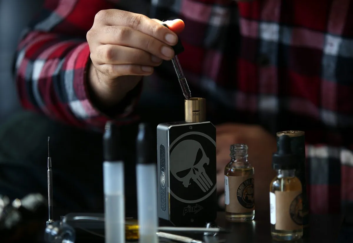 A customer fills a vaporizer, or E-Cigarette, with oil in San Rafael, Calif., on Jan. 28, 2015. (Justin Sullivan/Getty Images)