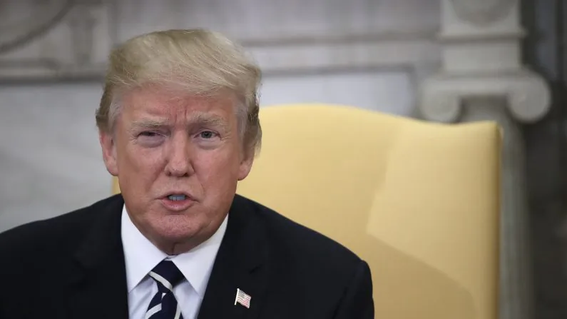 U.S. President Donald Trump speaks with American workers in the Oval Office about the recently passed tax reform package in Washington, DC on Jan. 31, 2018. The workers and Trump discussed benefits the package would have on the companies that employ them. (Win McNamee/Getty Images)