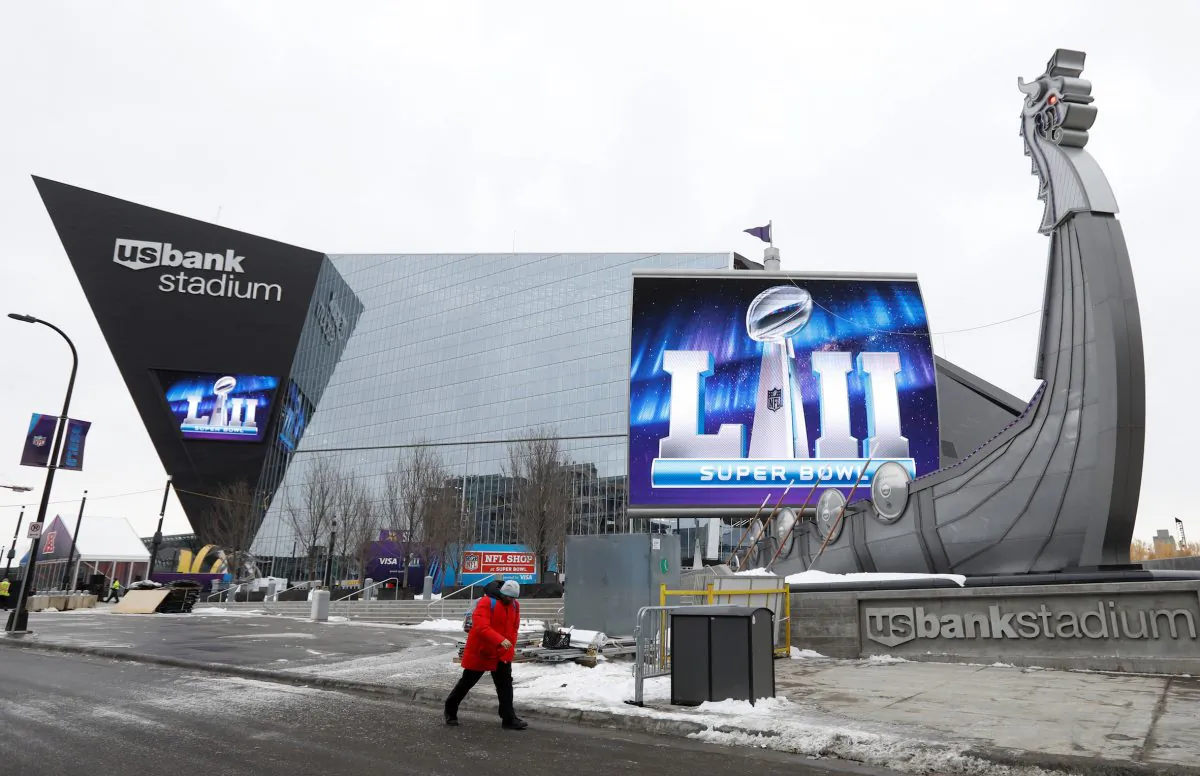 A man walks by US Bank Stadium, home to this weekend's Super Bowl, in downtown Minneapolis, Minnesota, U.S. January 30, 2018. (Reuters/Kevin Lamarque)