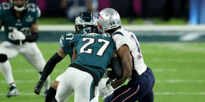 Malcolm Jenkins #27 of the Philadelphia Eagles tackles Brandin Cooks #14 of the New England Patriots during the second quarter in Super Bowl LII at U.S. Bank Stadium on Feb. 4, 2018 in Minneapolis, Minnesota. (Andy Lyons/Getty Images)