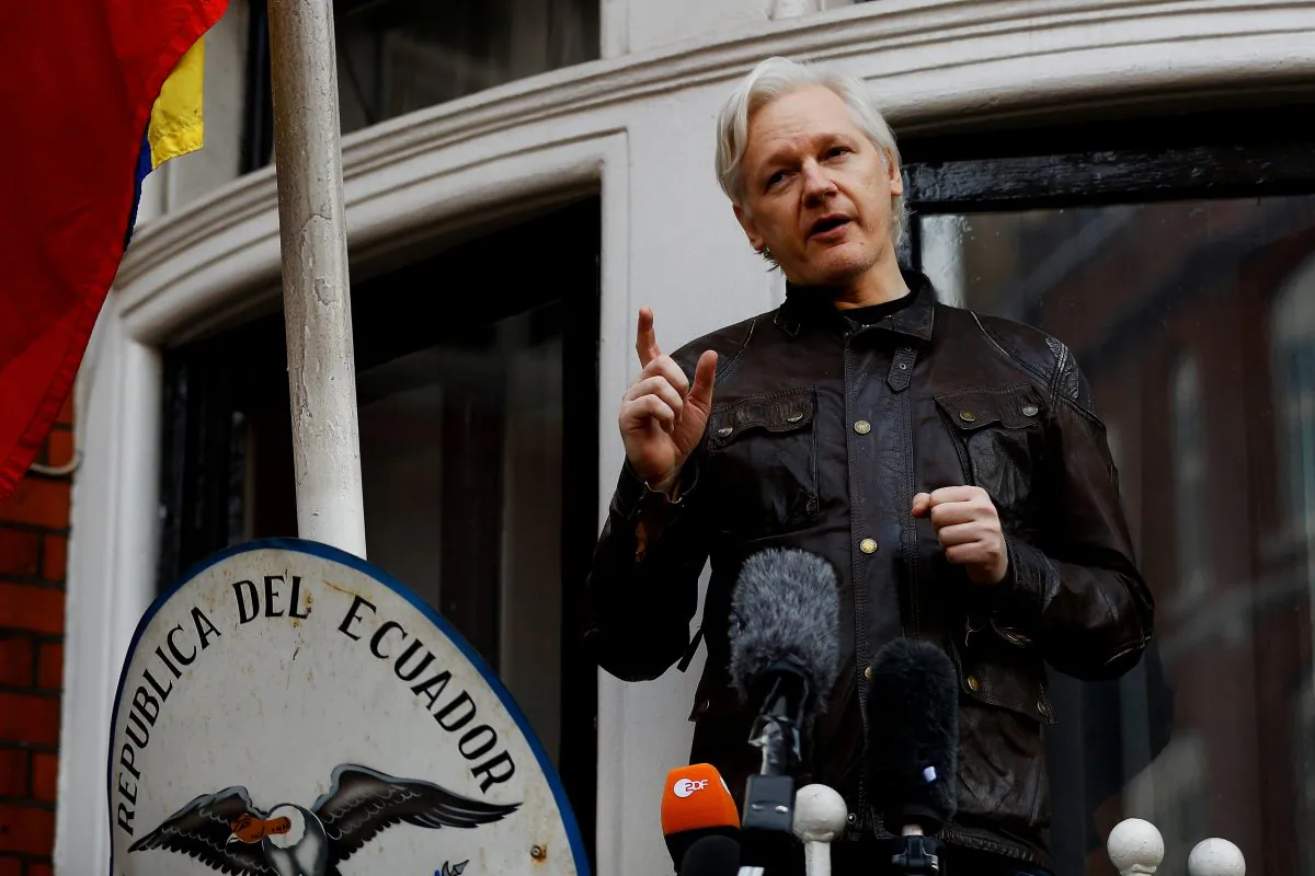 WikiLeaks founder Julian Assange is seen on the balcony of the Ecuadorian Embassy in London on May 19, 2017. (Reuters/Peter Nicholls/File Photo)