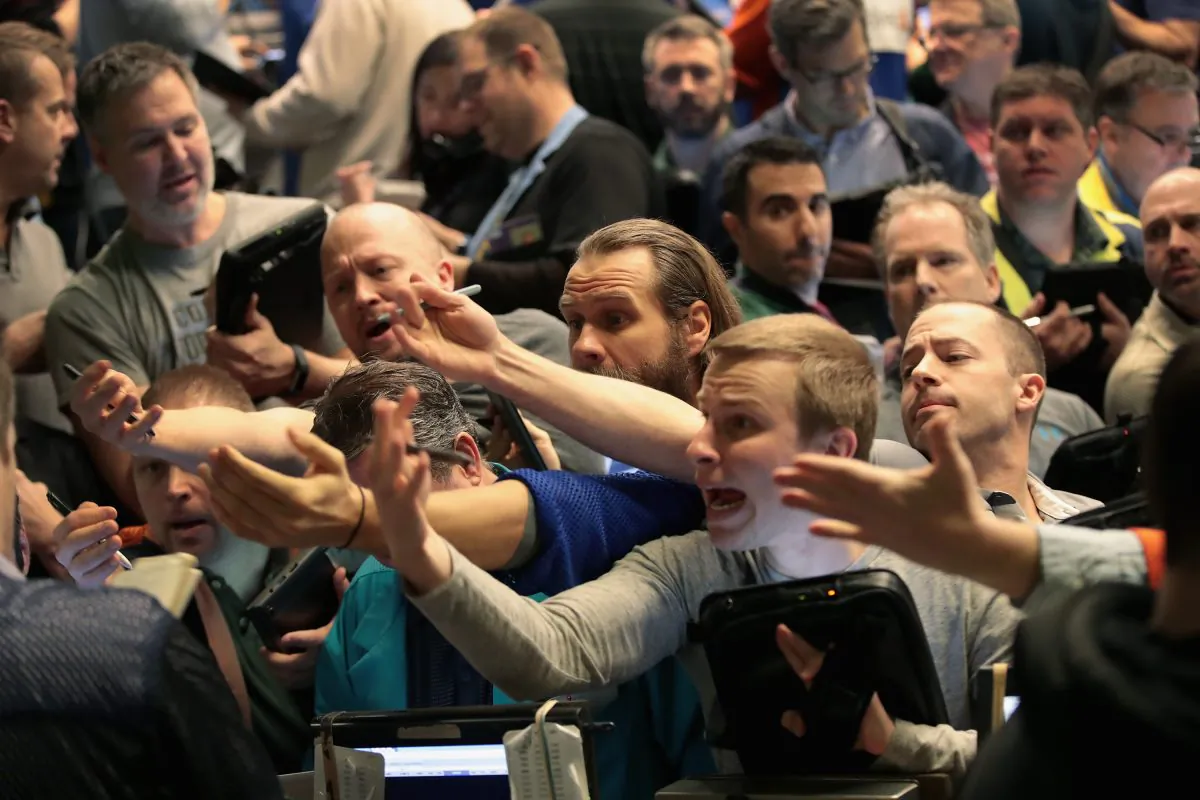 Traders signal offers in the S&P options pit at the Cboe Global Markets Inc. exchange in Chicago on Feb. 6.  (Scott Olson/Getty Images)