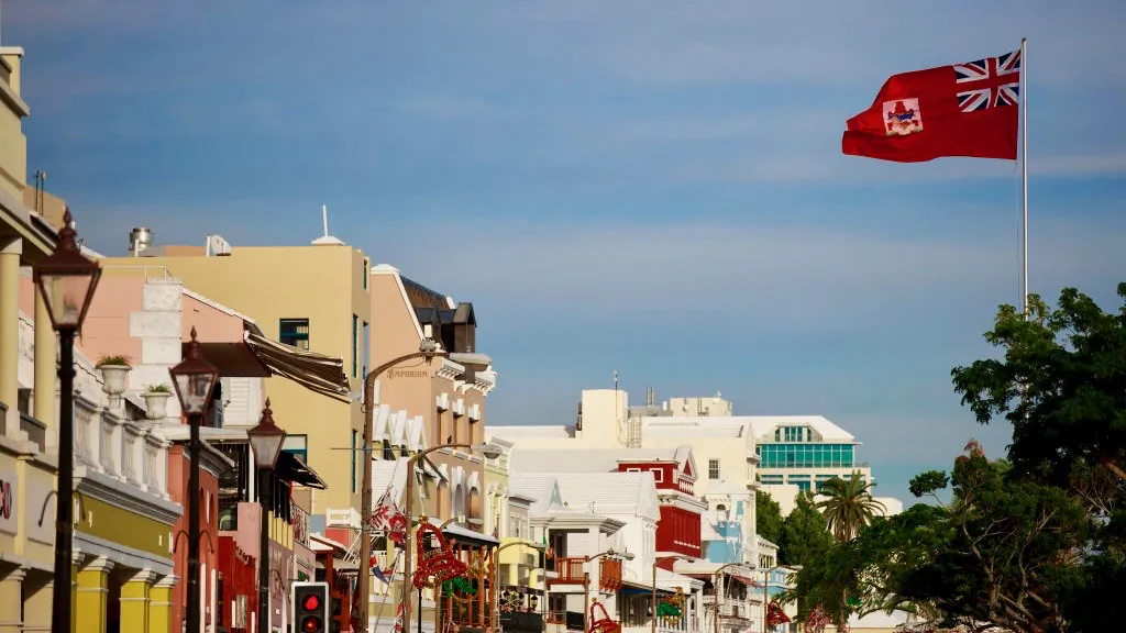 The flag of Bermuda flies along the commercial and retail district on Front Street, November 8, 2017 in Hamilton, Bermuda. (Drew Angerer/Getty Images)