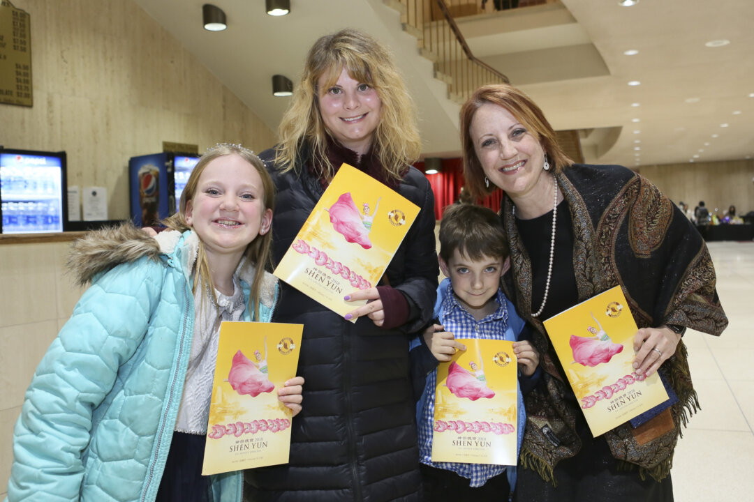 Dr. Raegan Kotsko (R) with her children enjoyed watching Shen Yun at the Chrysler Hall, Norfolk, Virginia on Feb. 8, 2018. (Lisa Fan/The Epoch Times)