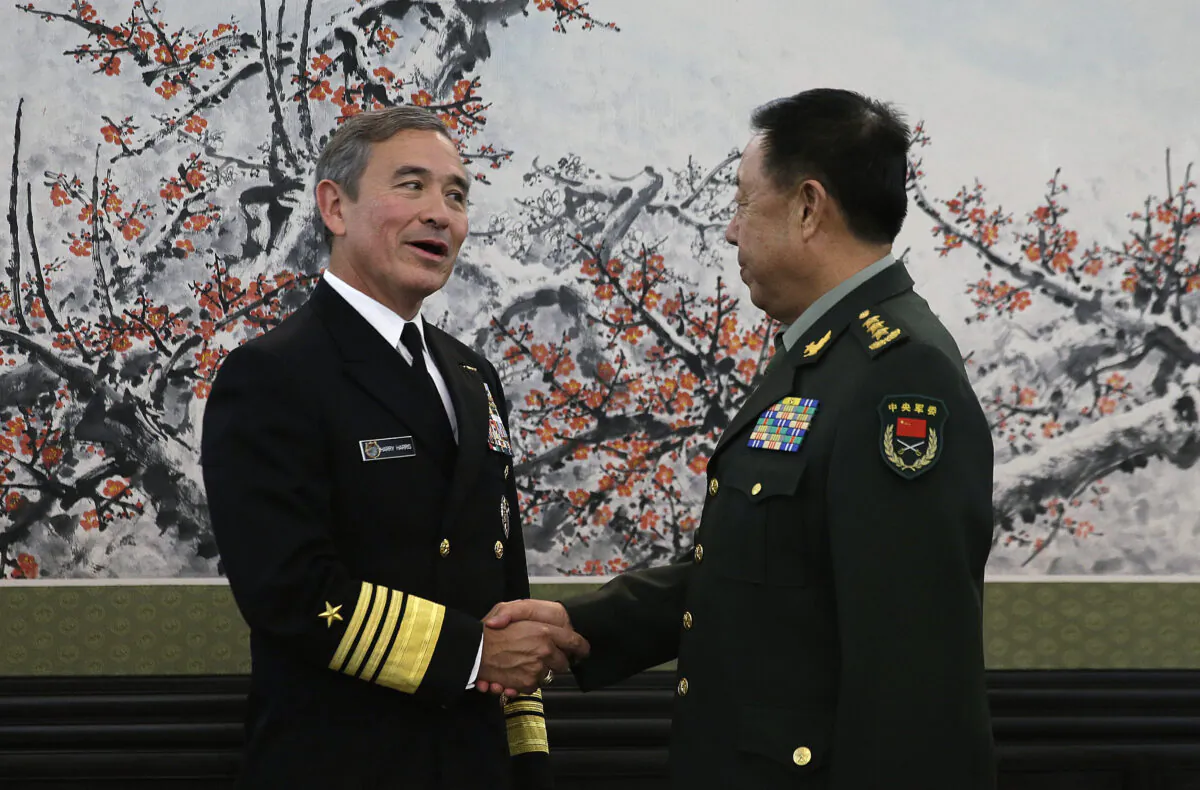 Adm. Harry B. Harris, Jr., U.S. Navy Commander, U.S. Pacific Command, left, shakes hands with Fan Changlong, vice-chairman of China's Central Military Commission before their meeting at the Bayi Building in Beijing, China, on Nov. 3, 2015. (Andy Wong/Getty Images)