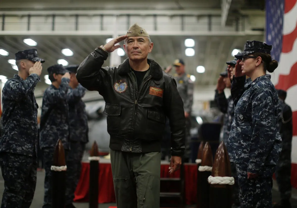U.S. Navy Adm. Harry Harris, Commander of the U.S. Pacific Command, salutes at a ceremony marking the start of Talisman Saber 2017, a biennial joint military exercise between the United States and Australia, aboard USS Bonhomme Richard on June 29, 2017. President Donald Trump has announced the intention to nominate Harris to be the next U.S. ambassador to Australia. (Jason Reed/AFP/Getty Images)