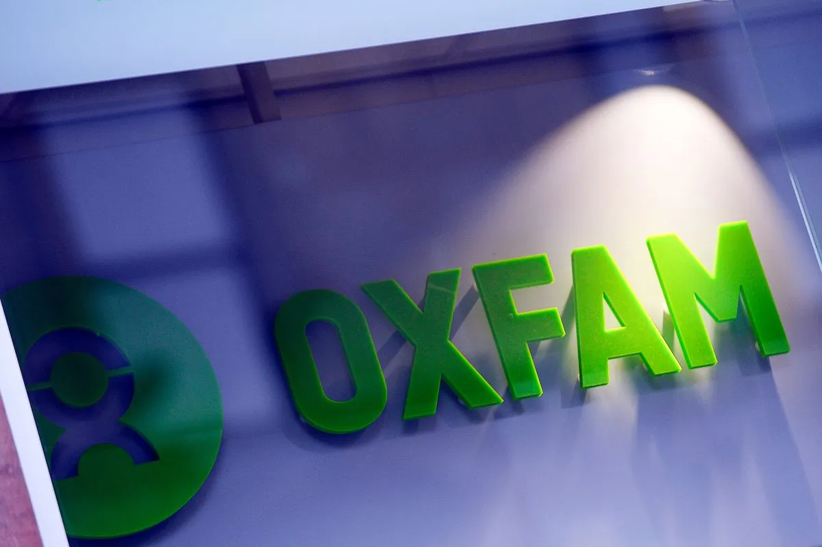 The logo on the front of an Oxfam bookshop is photographed in Glasgow on Feb. 10, 2018.
The British Government announced late on Feb.9 it was reviewing all work with Oxfam amid revelations the charity's staff hired prostitutes in Haiti during a 2011 relief effort on the earthquake-hit island. (ANDY BUCHANAN/AFP/Getty Images)