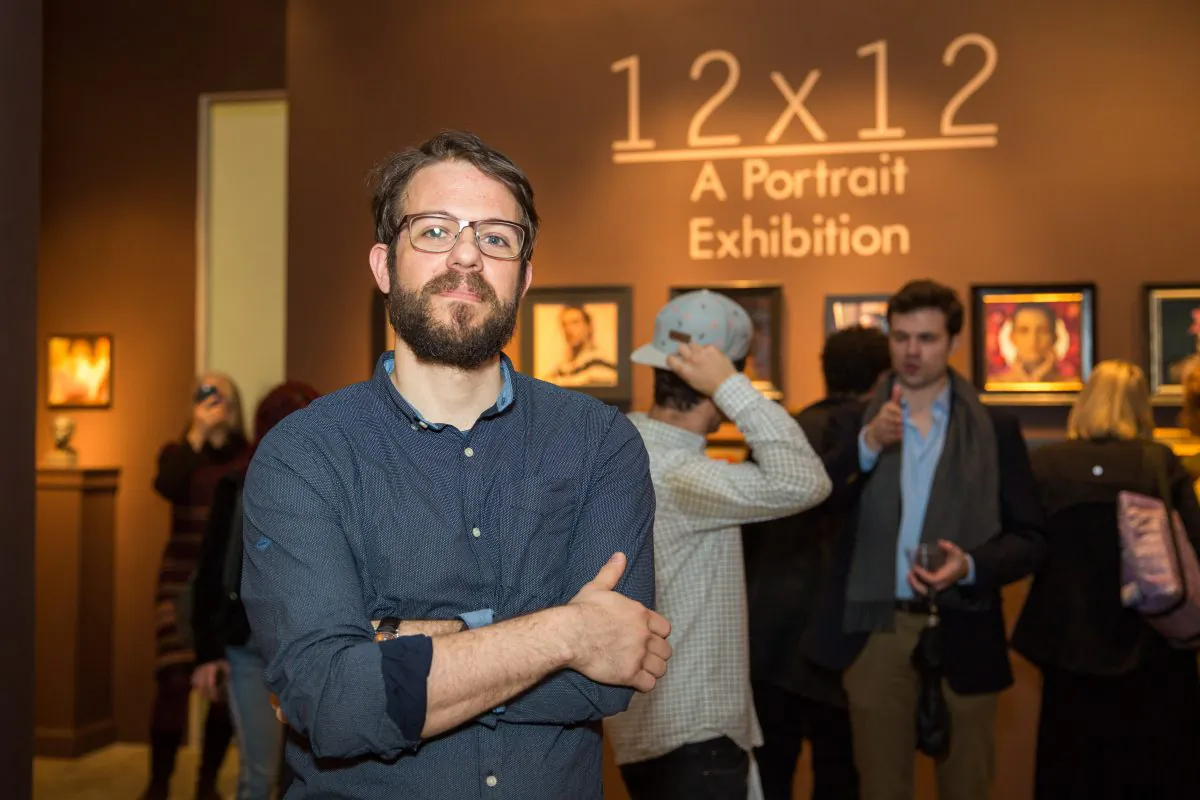 Stephen Bauman, artist and curator of "12x12, A Portrait Exhibition," at the opening in the gallery of The Florence Academy of Art, at Mana Contemporary in Jersey City, N.J., on Jan. 12, 2018. (Benjamin Chasteen/The Epoch Times)