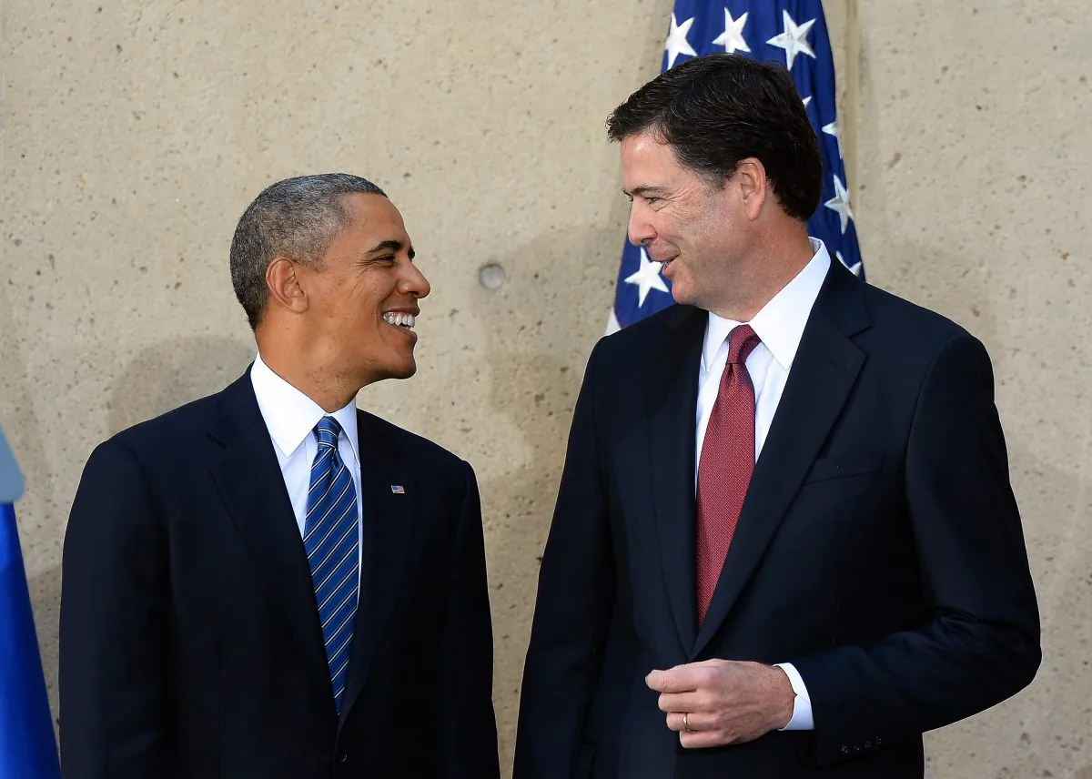Then-president Barack Obama (L) talks with then-FBI director James Comey on October 28, 2013. (JEWEL SAMAD/AFP/Getty Images)