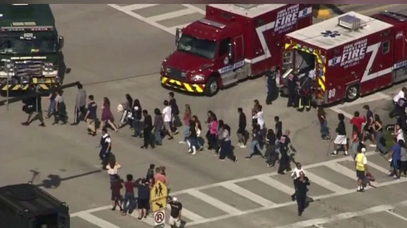 Students are evacuated from Marjory Stoneman Douglas High School during a shooting incident in Parkland, Florida, U.S. February 14, 2018 in a still image from video. (WSVN.com via REUTERS)