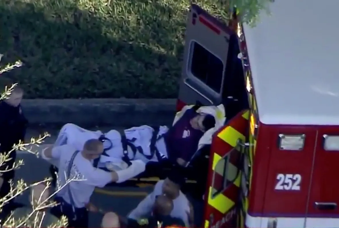 Nicolas de Jesus Cruz was placed in handcuffs by police is loaded into a paramedic vehicle after a shooting incident at Marjory Stoneman Douglas High School in Parkland, Florida, Feb. 14, 2018 in a still image from video. (WSVN.com via Reuters)