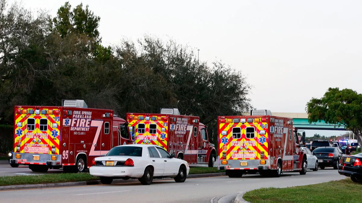 Fire Rescue vehicles block the road to Marjory Stoneman Douglas High School in Parkland, Fla., on Feb. 14, 2018, following a school shooting. (Rhona Wise/AFP/Getty Images)