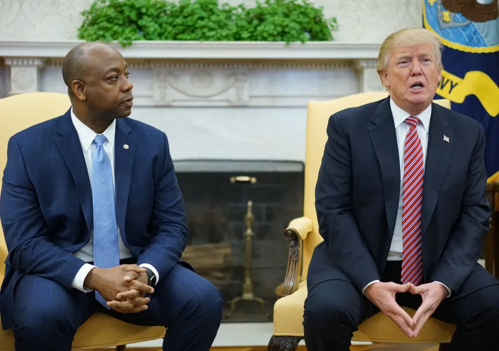 Senator Tim Scott (R-S.C.) and then-President Donald Trump are seen n the Oval Office of the White House in Washington on Feb. 14, 2018. (Mandel Ngan/AFP/Getty Images)
