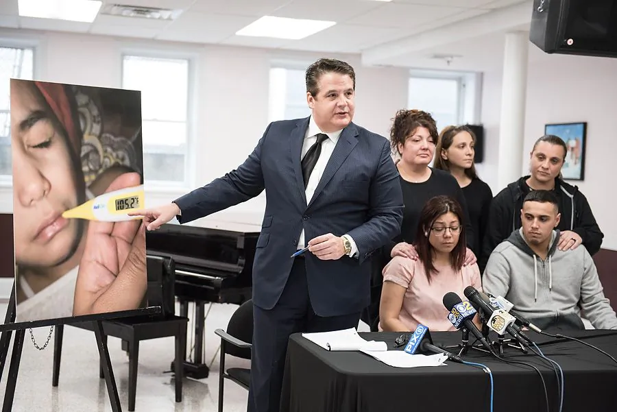 Lawyer Louis Zayas points to a picture taken of Nevaeh Hernandez when she was sick with the flu.