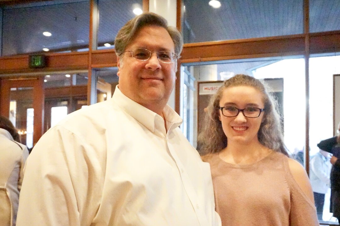 Project Manager Mark Bosveld and Michaela Bosveld, a dance student, enjoyed the Shen Yun performance at the Ordway Center for the Performing Arts in St. Paul, on Feb. 17, 2018. (Catherine Wen/The Epoch Times)