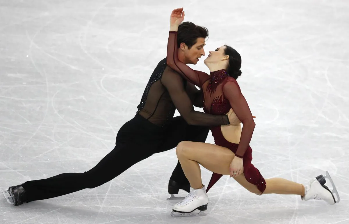 Tessa Virtue and Scott Moir perform at the ice dance free dance competition during the Pyeongchang 2018 Winter Olympics on Feb. 20, 2018. (Reuters/Phil Noble)