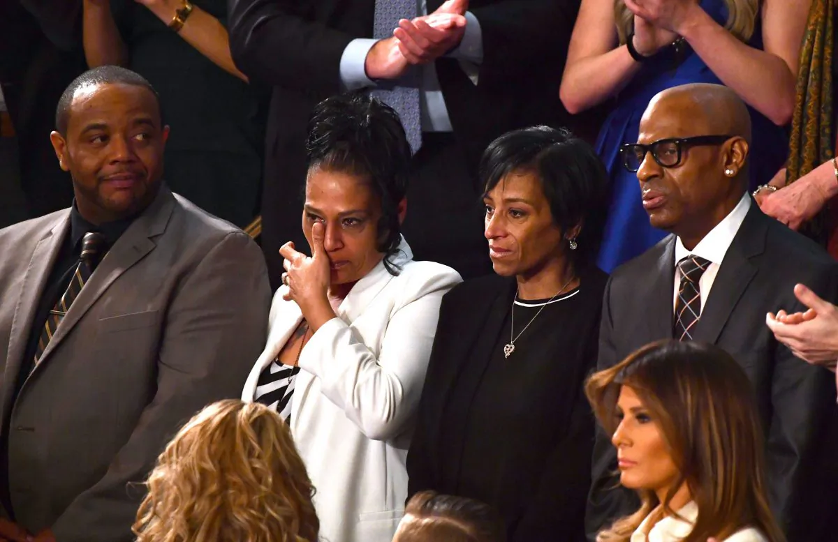 (L-R) Robert Mickens, Elizabeth Alvarado, Evelyn Rodriguez, and Freddy Cuevas are recognized during the State of the Union address at the US Capitol in Washington, DC, on January 30, 2018. / AFP PHOTO / Nicholas Kamm        (Photo credit should read NICHOLAS KAMM/AFP/Getty Images)